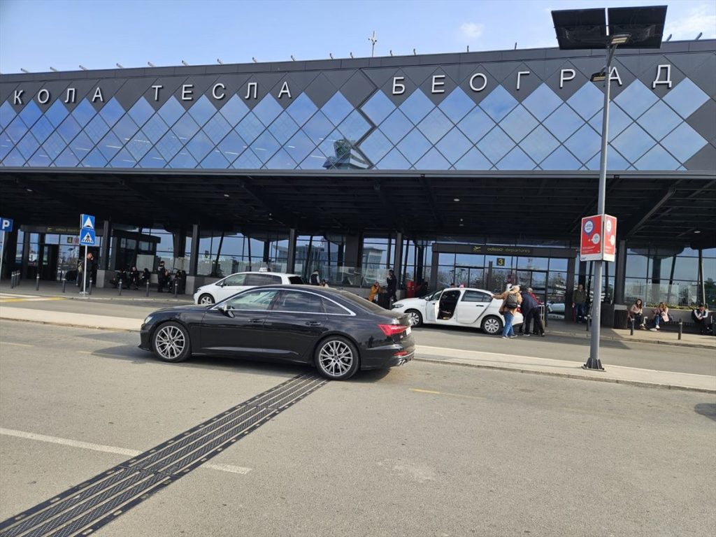 Belgrade Airport Transfer: Taxi, Bus, or Chauffeur? Premium chauffeur vehicle outside the arrivals zone at Belgrade Nikola Tesla Airport