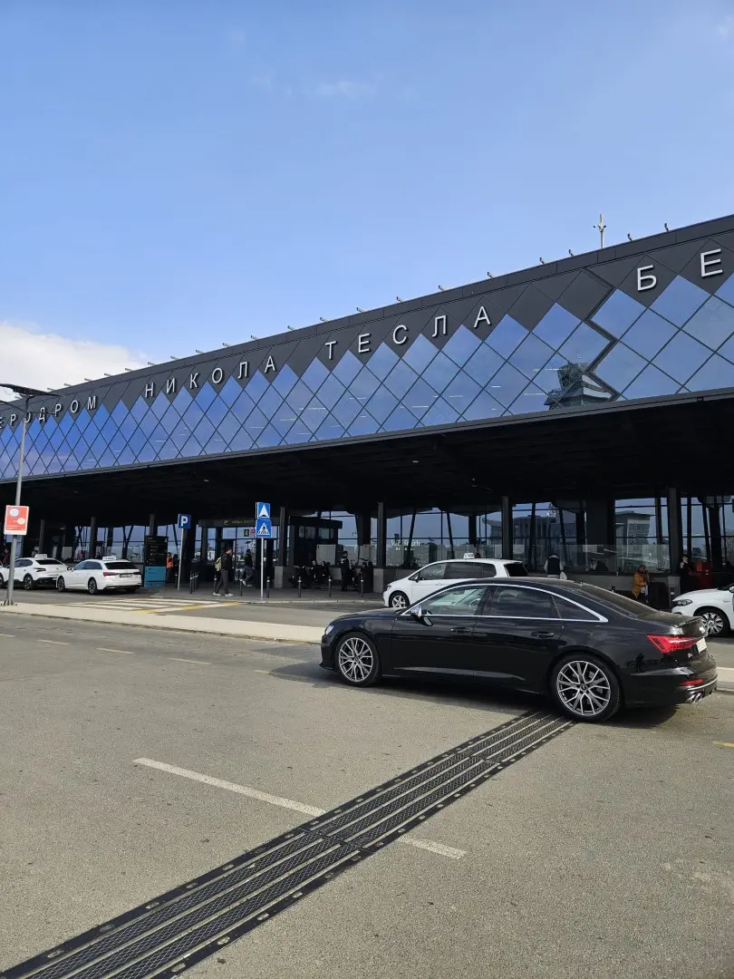 Journal Premium sedan at airport curbside