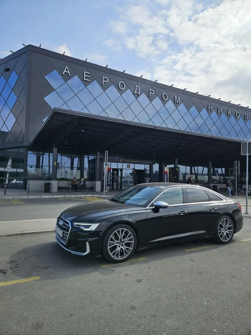 Airport transfer vehicle prepared outside a terminal