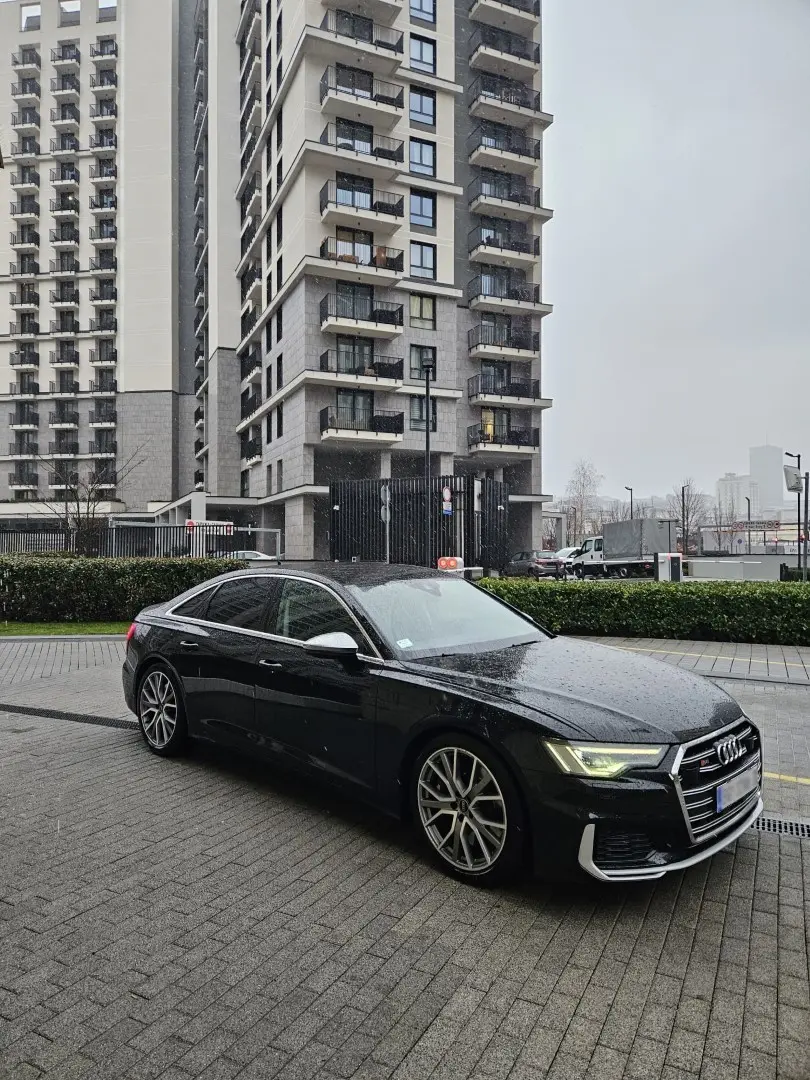 Business sedan arriving at a corporate courtyard