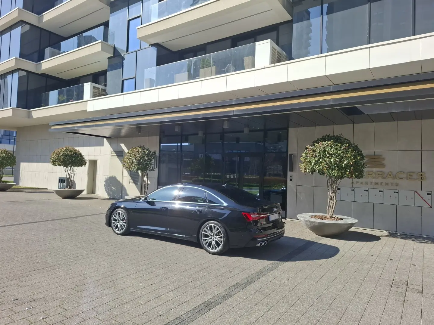 Home Executive sedan prepared outside a modern residence