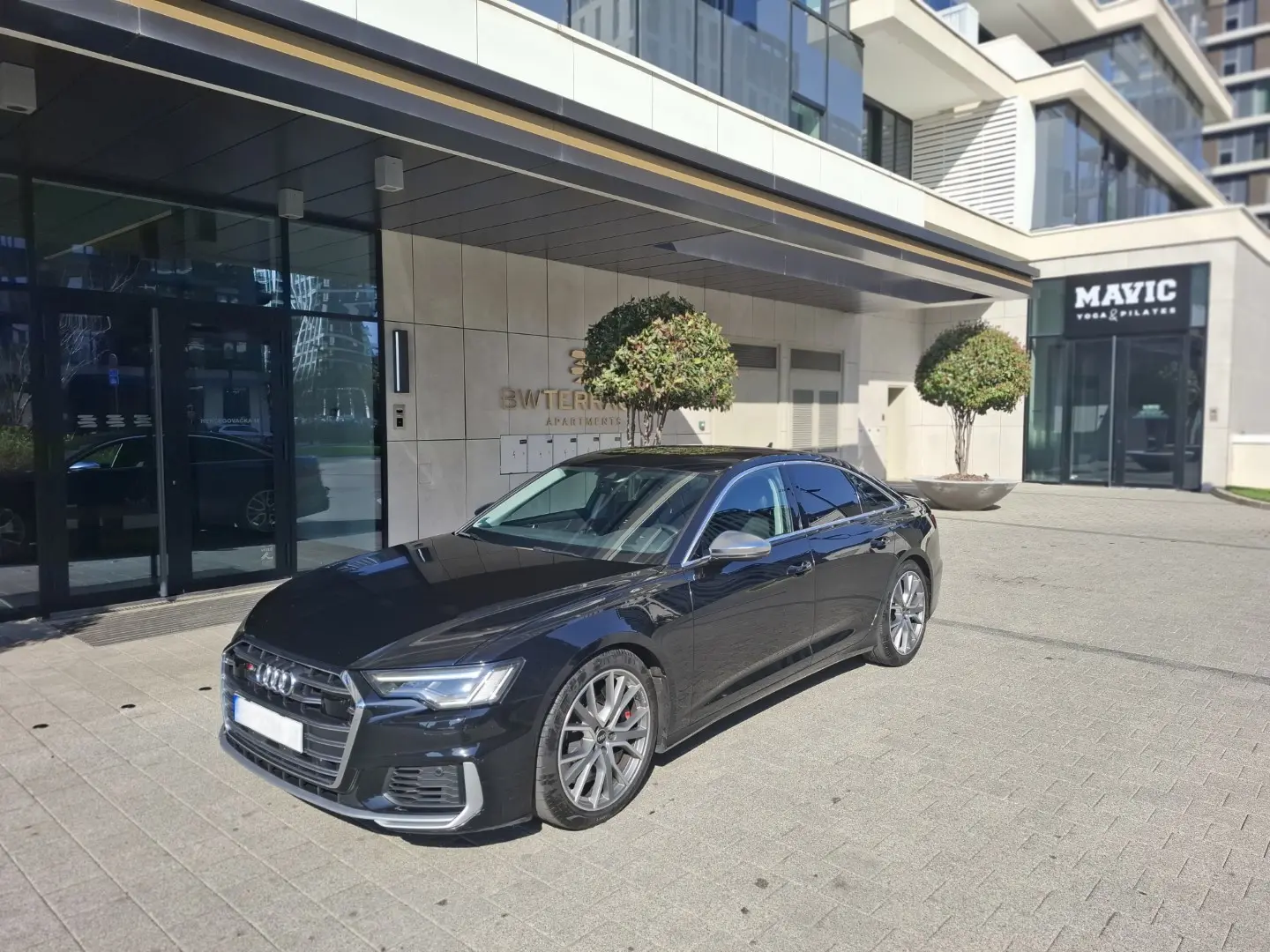 Home Executive sedan class prepared at hotel entrance