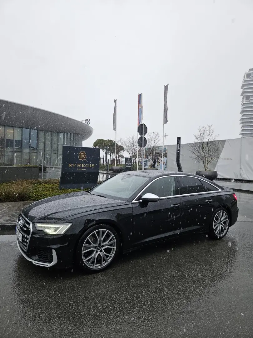 Home Luxury sedan class outside a hotel